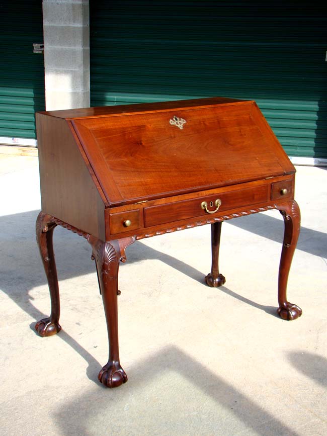An 18th century Irish mahogany slant-front desk on cabriole legs circa 1750